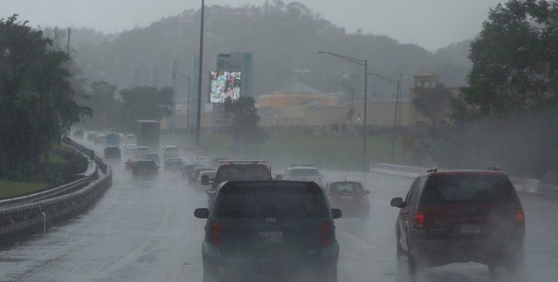 Cars drive on a highway during rain before the arrival of the Hurricane Maria in San Juan Cars drive on a highway during rain before the arrival of the Hurricane Maria in San Juan